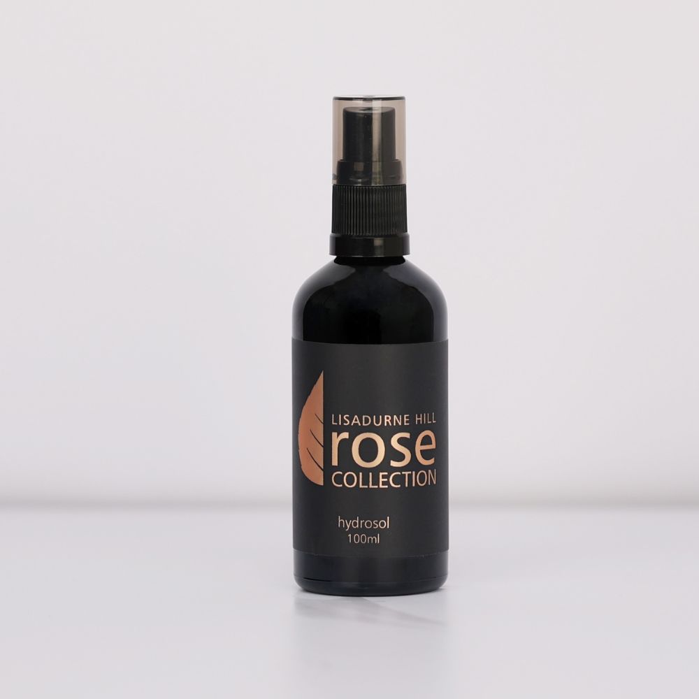a brown protective bottle containing Damask Roses as a rose hydrosol 100ml from The Rose Collection